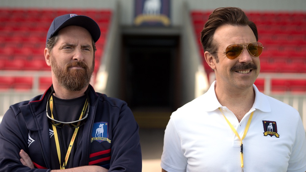 Brendan Hunt and Jason Sudeikis in “Ted Lasso,” now streaming on Apple TV+.